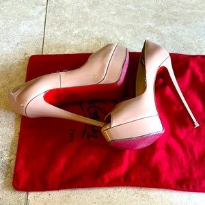 Open toed nude heels.